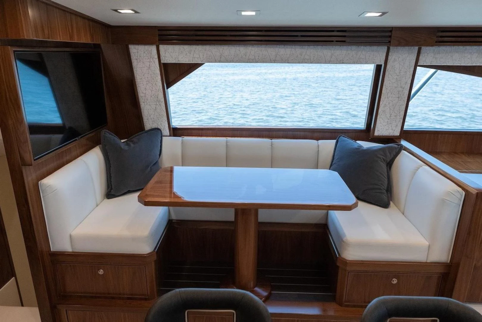 a room with a table and chairs aboard GAME ON Yacht for Sale