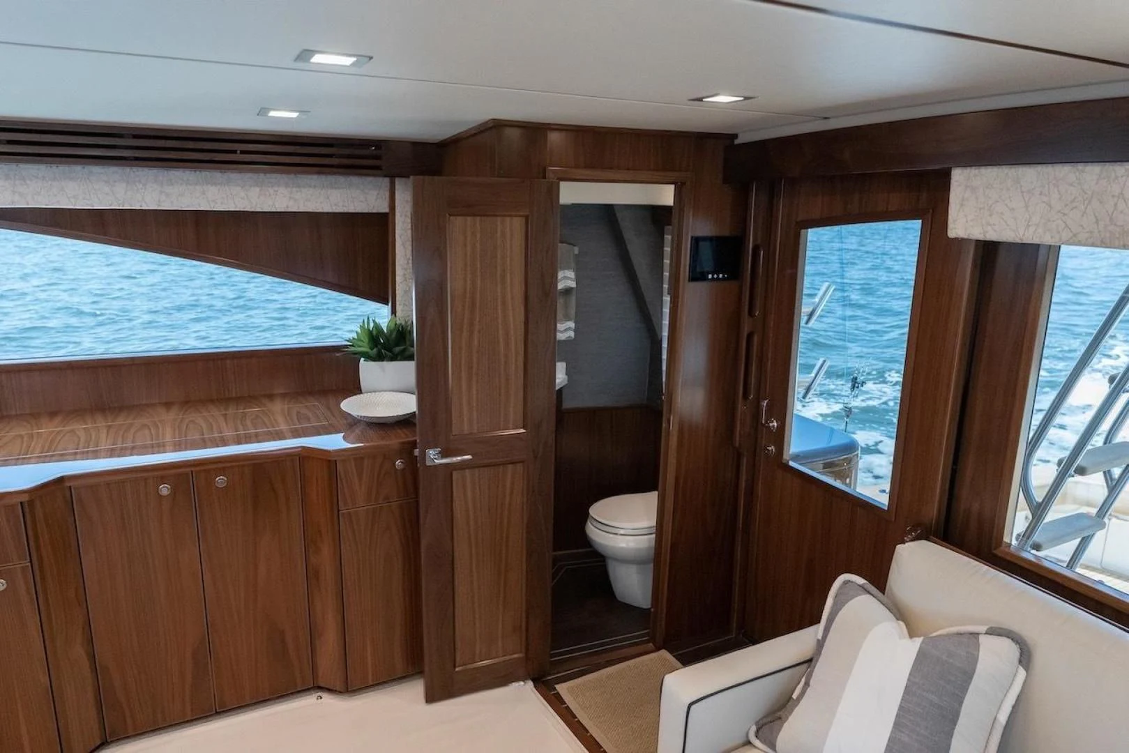 a bathroom with a wood door aboard GAME ON Yacht for Sale