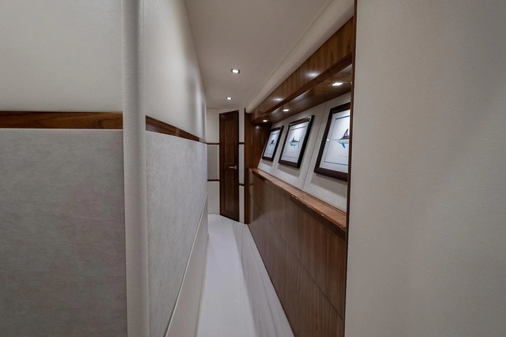 a hallway with a window and a door aboard GAME ON Yacht for Sale