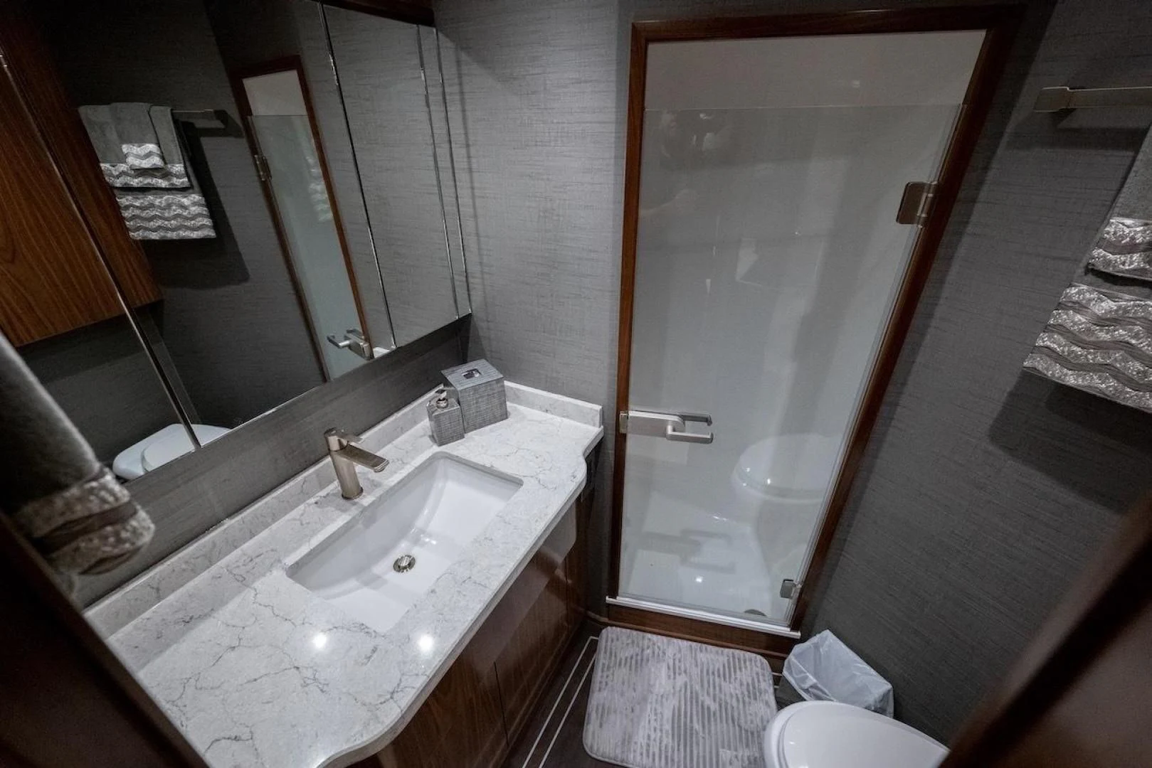 a bathroom with a sink and a mirror aboard GAME ON Yacht for Sale