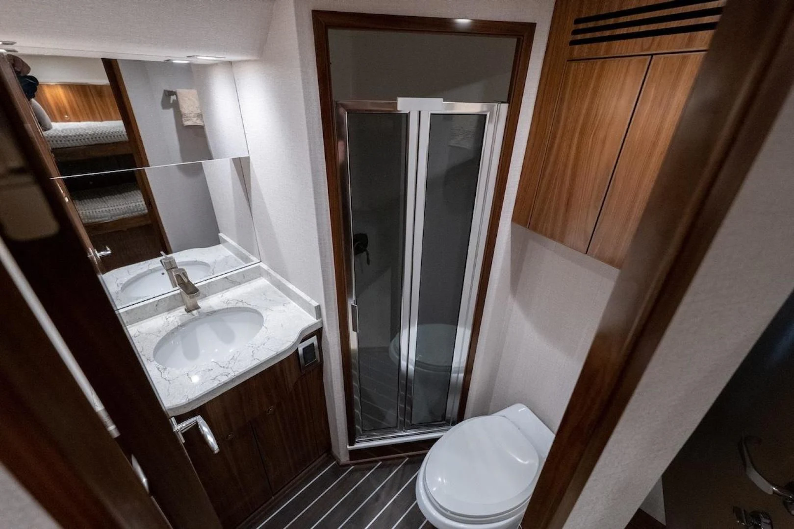a bathroom with a glass shower aboard GAME ON Yacht for Sale