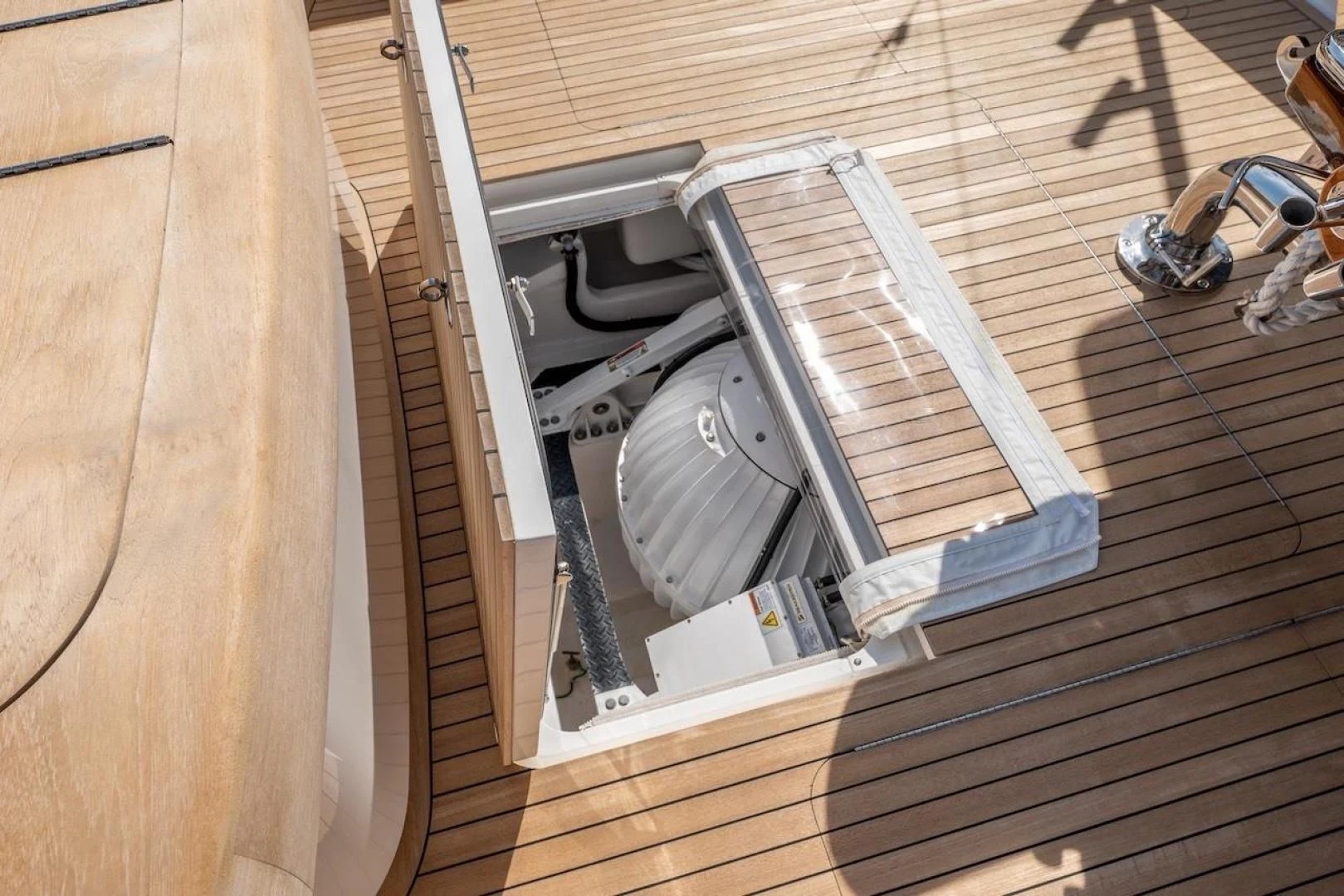 a satellite dish on a wooden surface aboard GAME ON Yacht for Sale