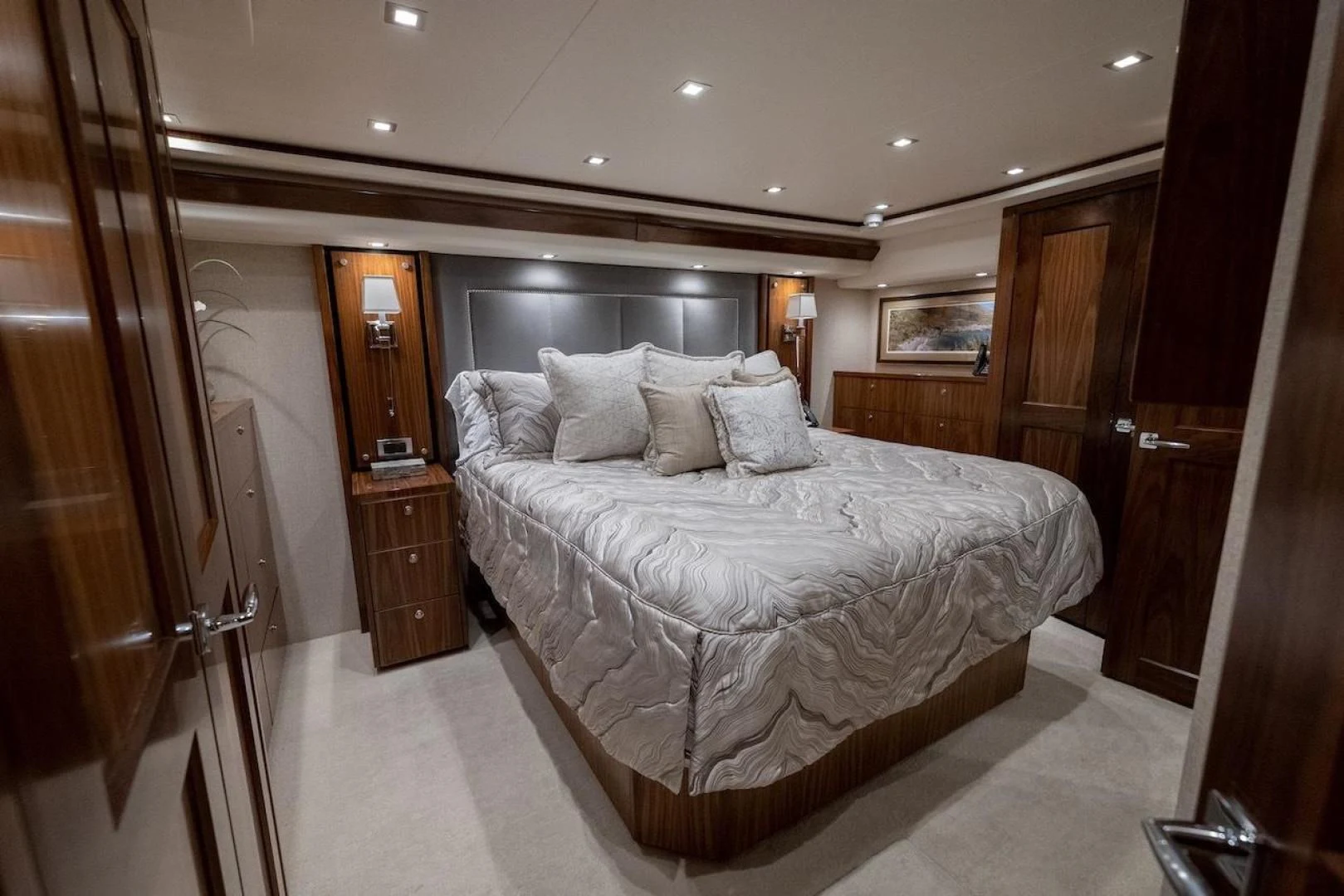a large bed in a hotel room aboard GAME ON Yacht for Sale