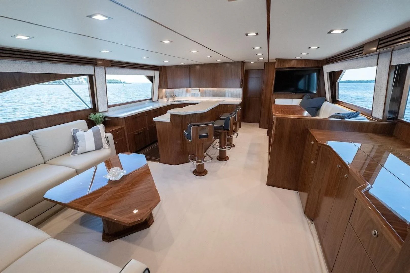 a room with a couch and a table aboard GAME ON Yacht for Sale