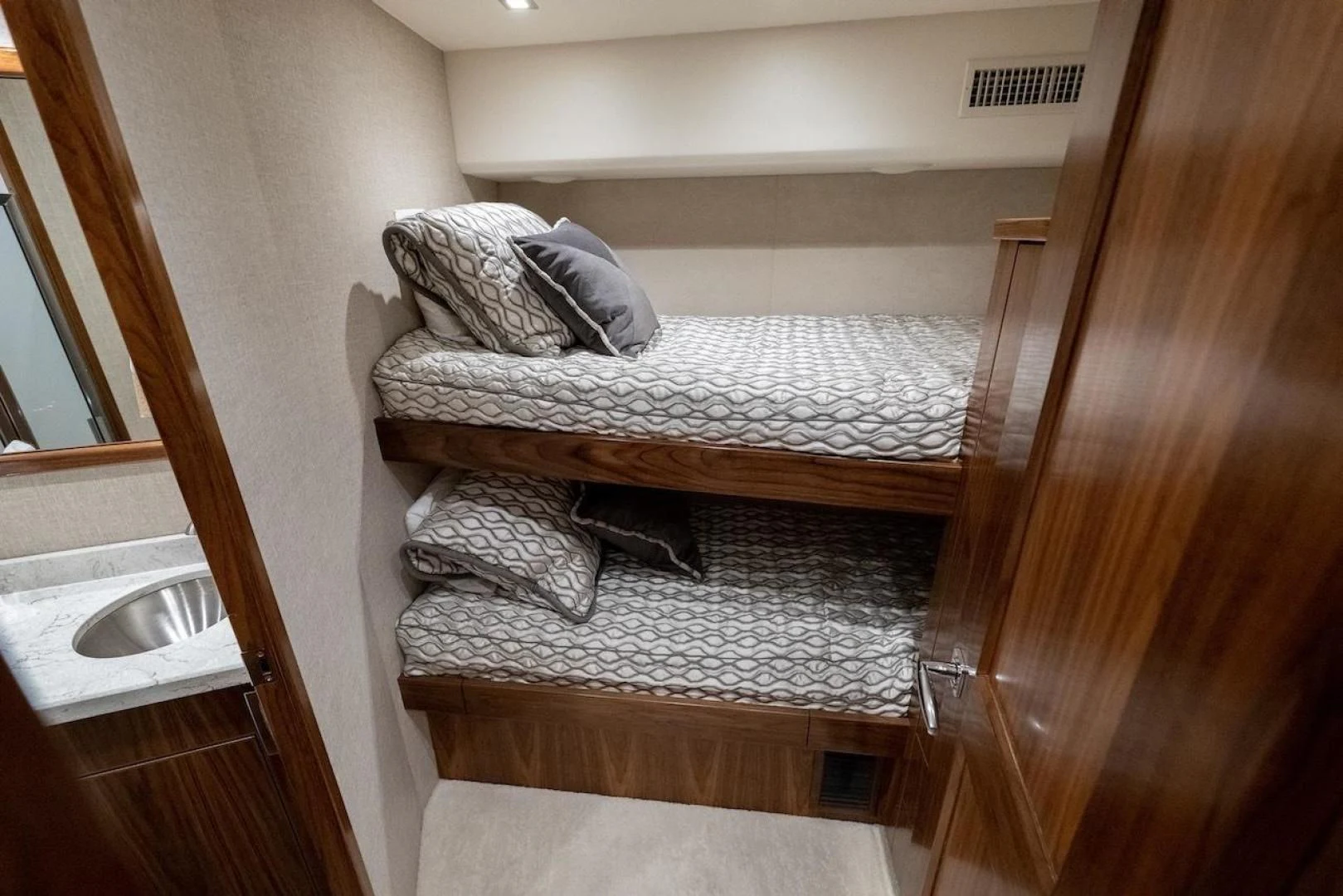 a bed with a sink aboard GAME ON Yacht for Sale