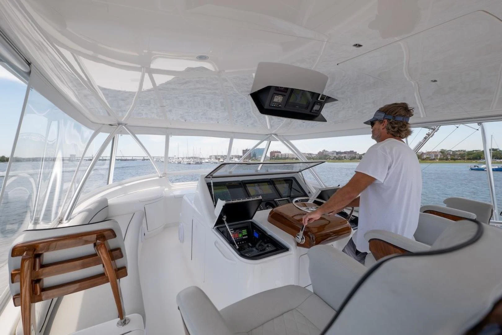 a man sitting on a boat aboard GAME ON Yacht for Sale