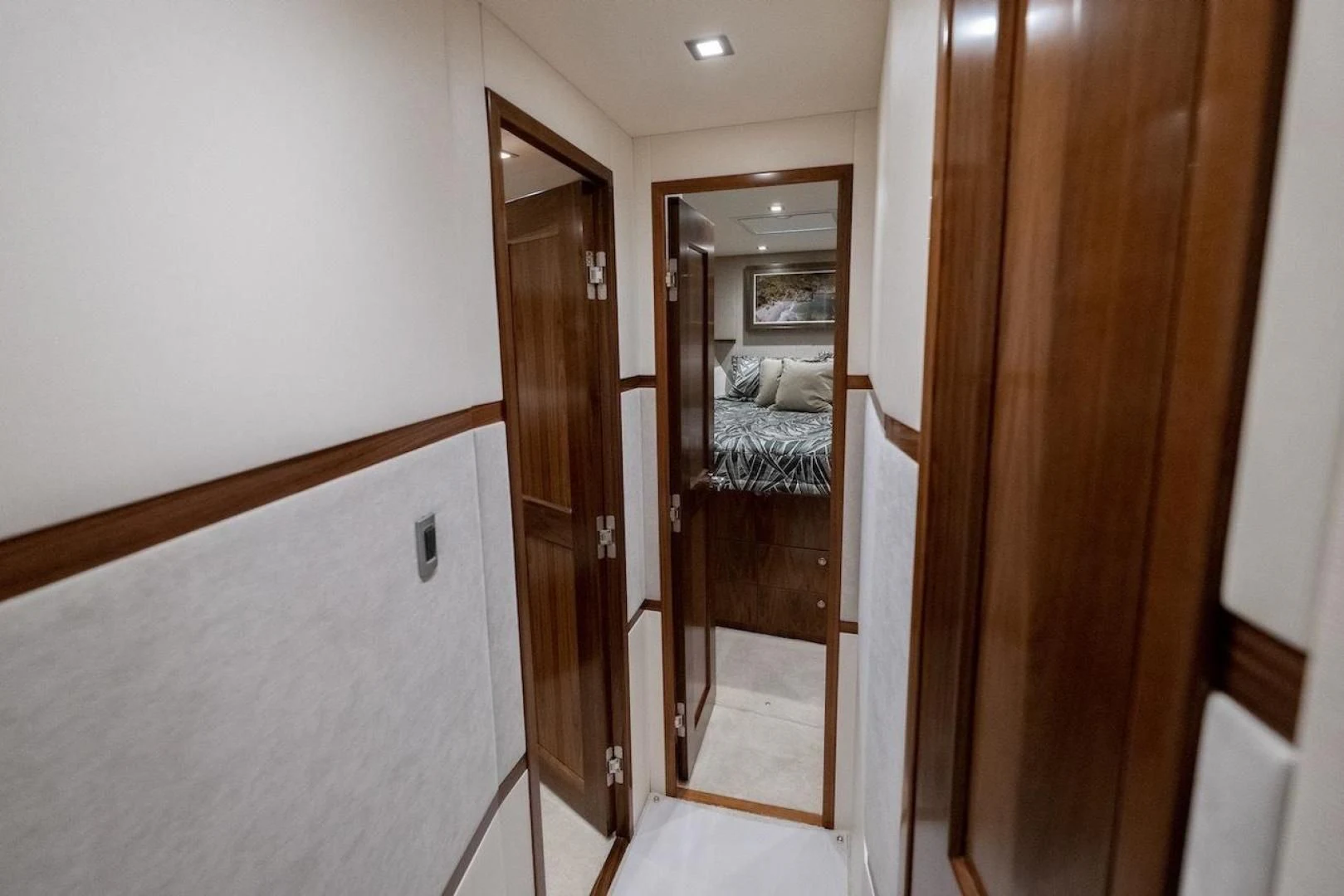 a room with a mirror and a bed aboard GAME ON Yacht for Sale