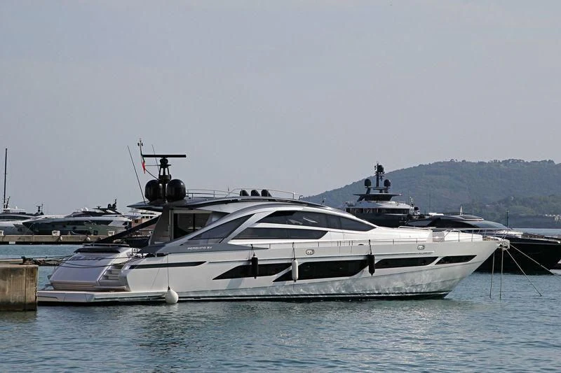 a boat docked at a pier aboard NAJATI Yacht for Sale