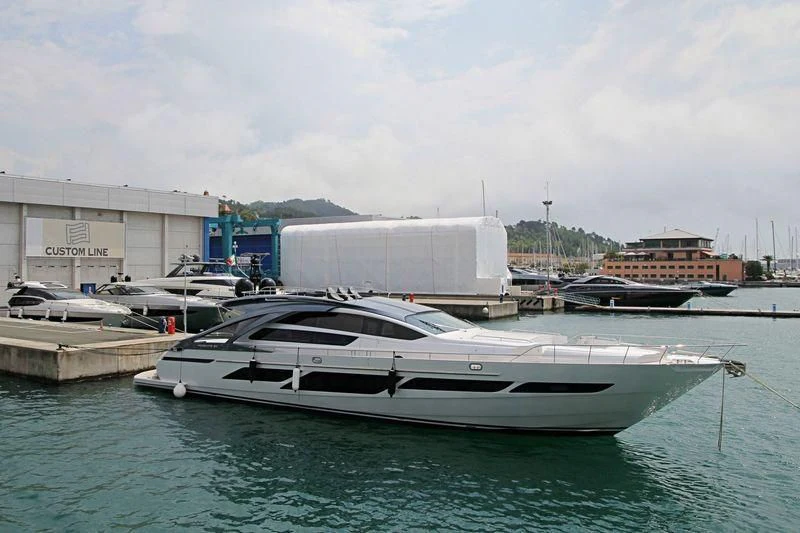 a white boat in a harbor aboard NAJATI Yacht for Sale