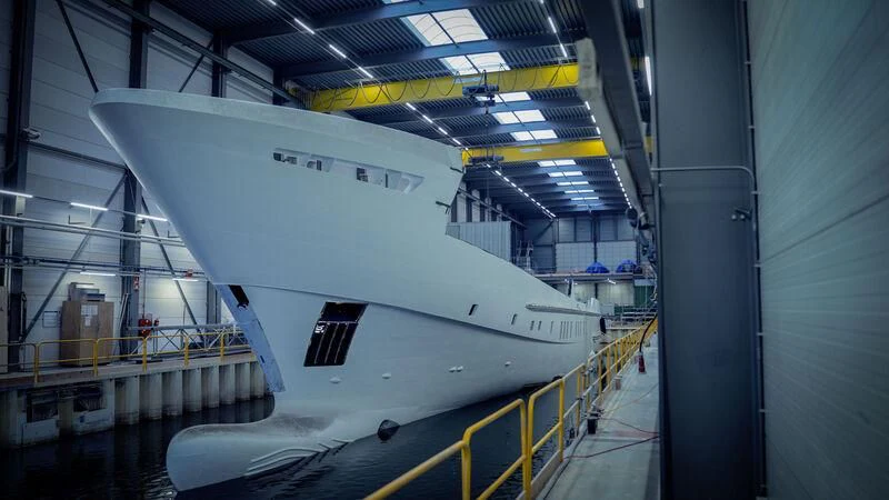 a large white airplane in a hangar aboard SOLEMATES Yacht for Sale