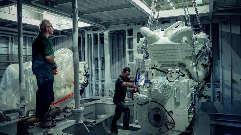 a man and a woman in a factory aboard SOLEMATES Yacht for Sale