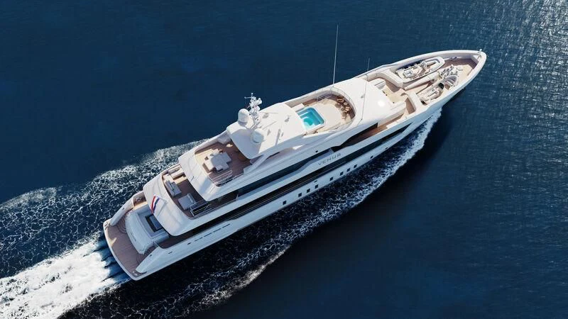 a small white boat on the water aboard SOLEMATES Yacht for Sale