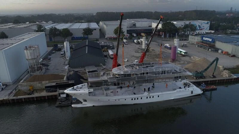 a large boat docked at a port aboard SOLEMATES Yacht for Sale