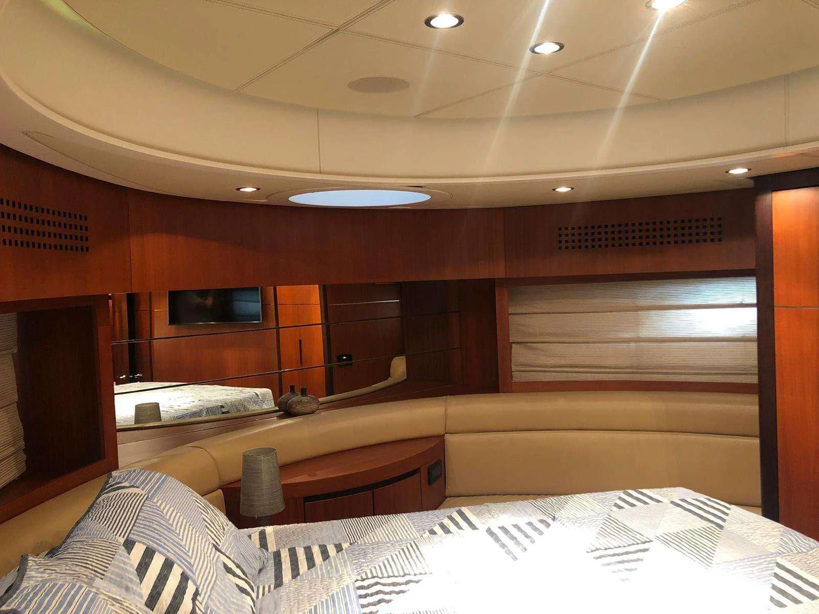 a room with a bed and a television aboard REGAL Yacht for Sale