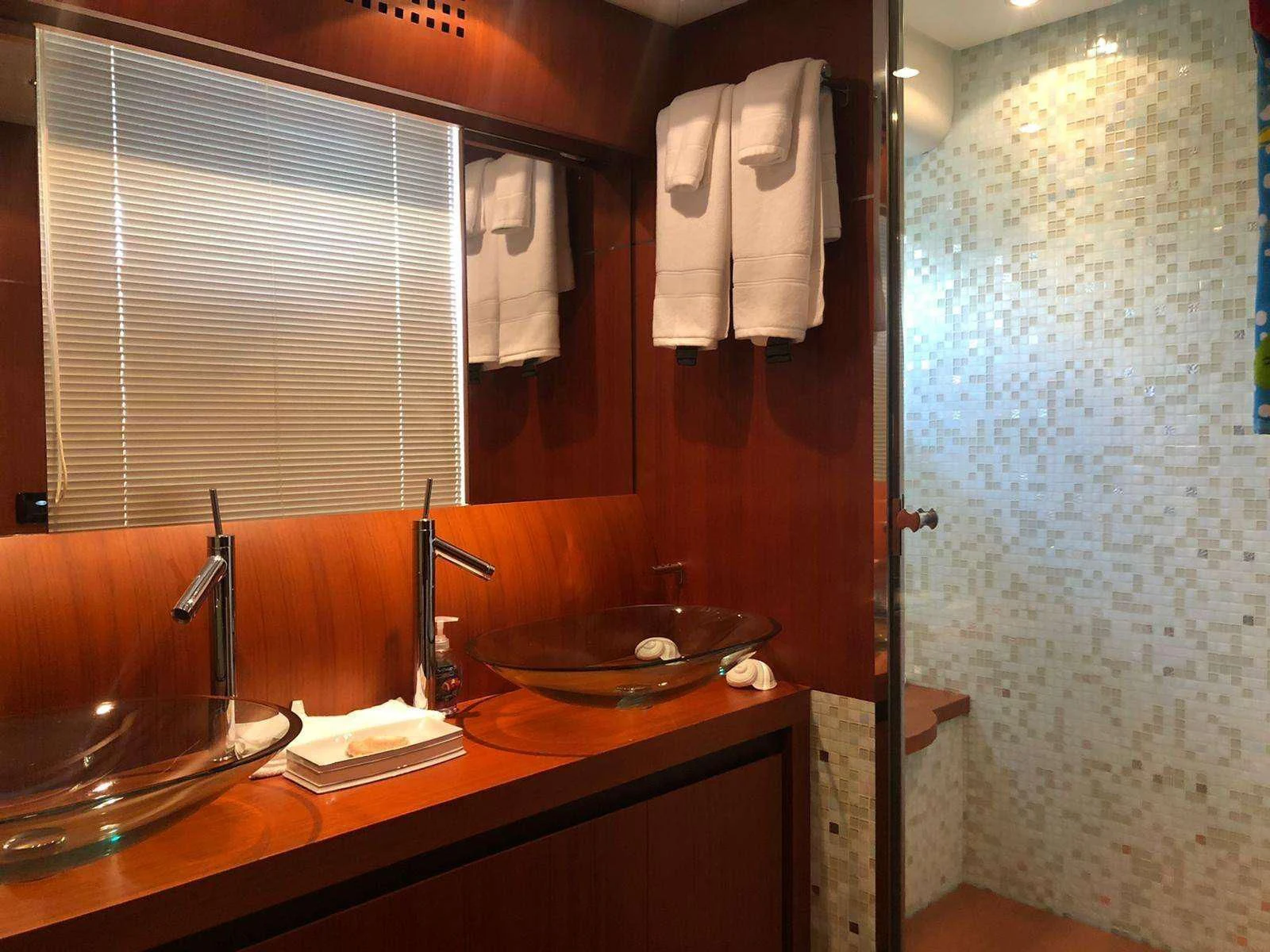 a bathroom with a sink and a mirror aboard REGAL Yacht for Sale