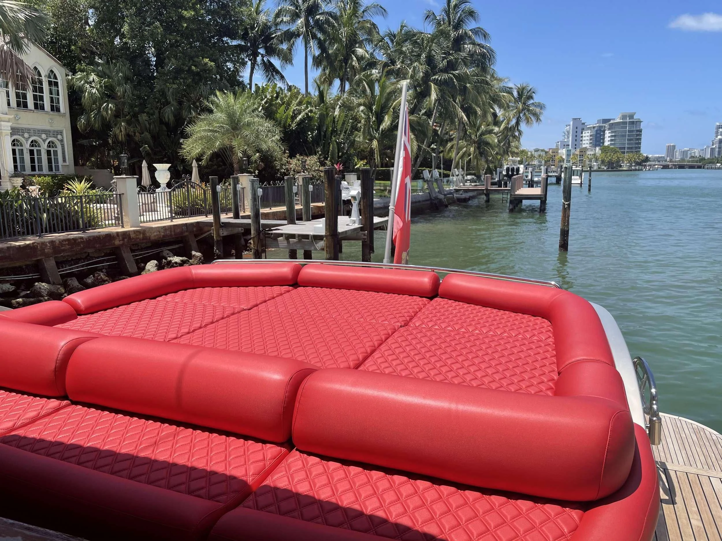 a row of red seats on a boat in the water aboard REGAL Yacht for Sale