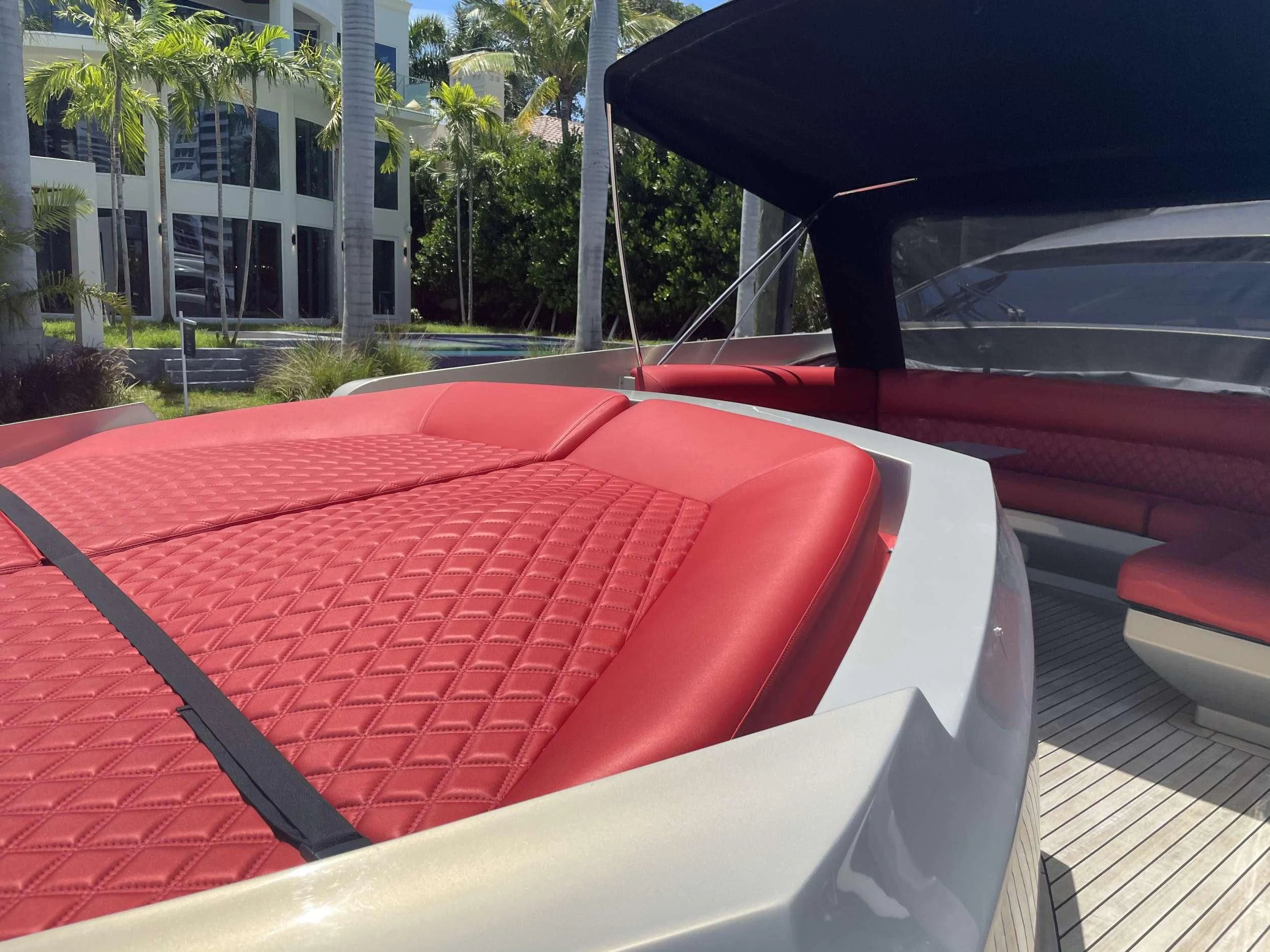 a red table outside aboard REGAL Yacht for Sale