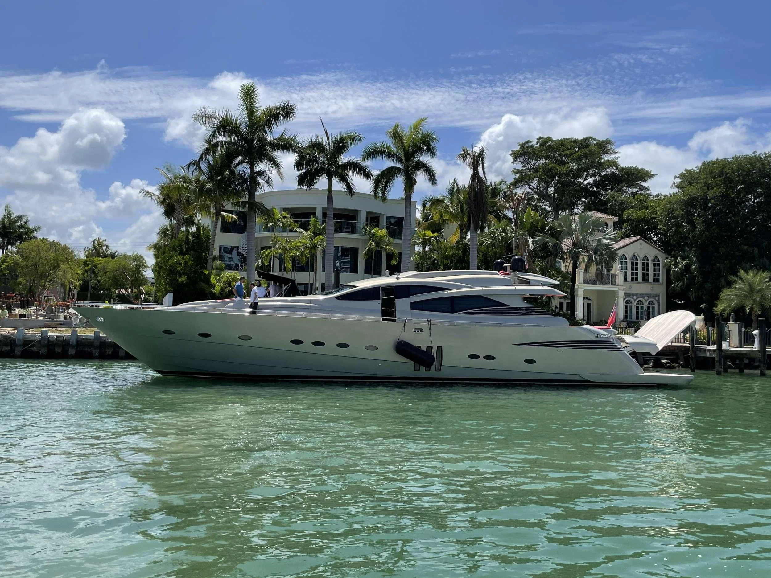 a white boat in a body of water aboard REGAL Yacht for Sale
