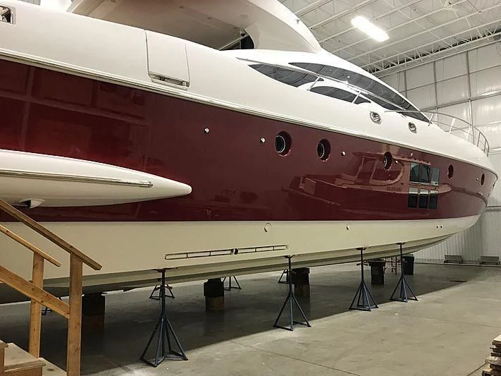 a large white ship in a building aboard PLANE II SEA Yacht for Sale
