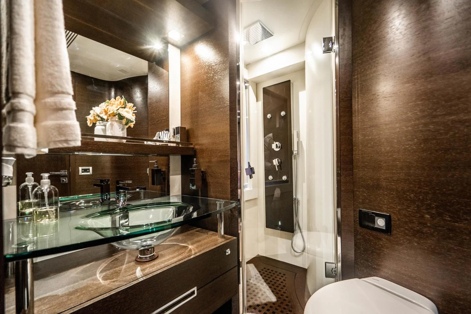 a bathroom with a countertop sink and a mirror aboard PLANE II SEA Yacht for Sale
