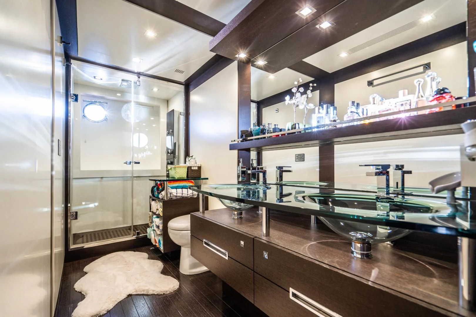 a room with shelves and a sink aboard PLANE II SEA Yacht for Sale