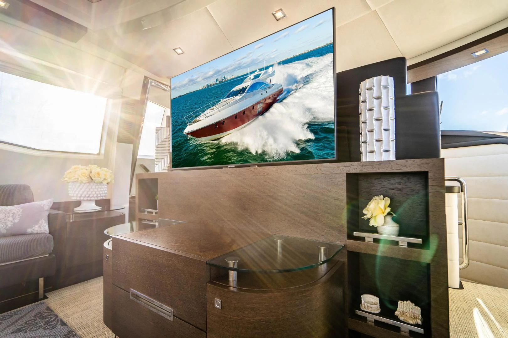 a room with a tv and a couch aboard PLANE II SEA Yacht for Sale