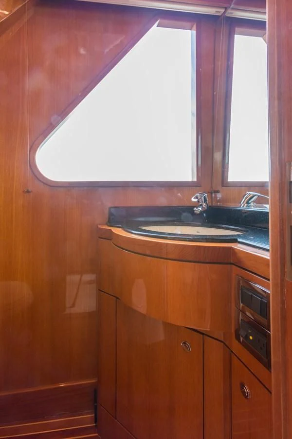 a kitchen with a sink and a window aboard SOMEWHERE IN TIME Yacht for Sale