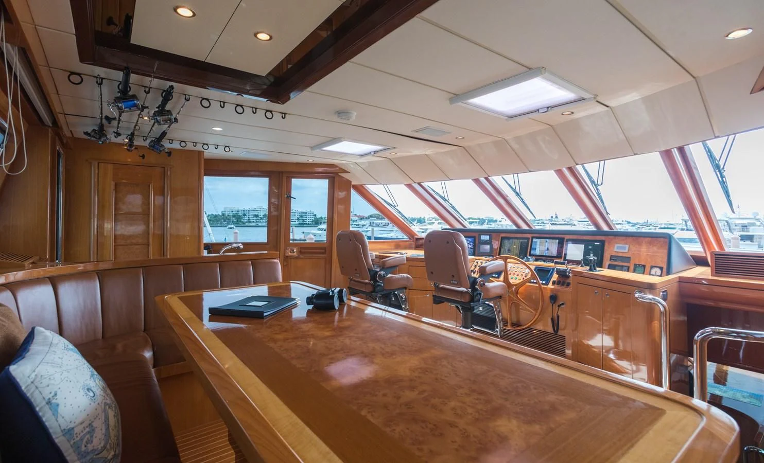 a room with a table chairs and a large window aboard SOMEWHERE IN TIME Yacht for Sale
