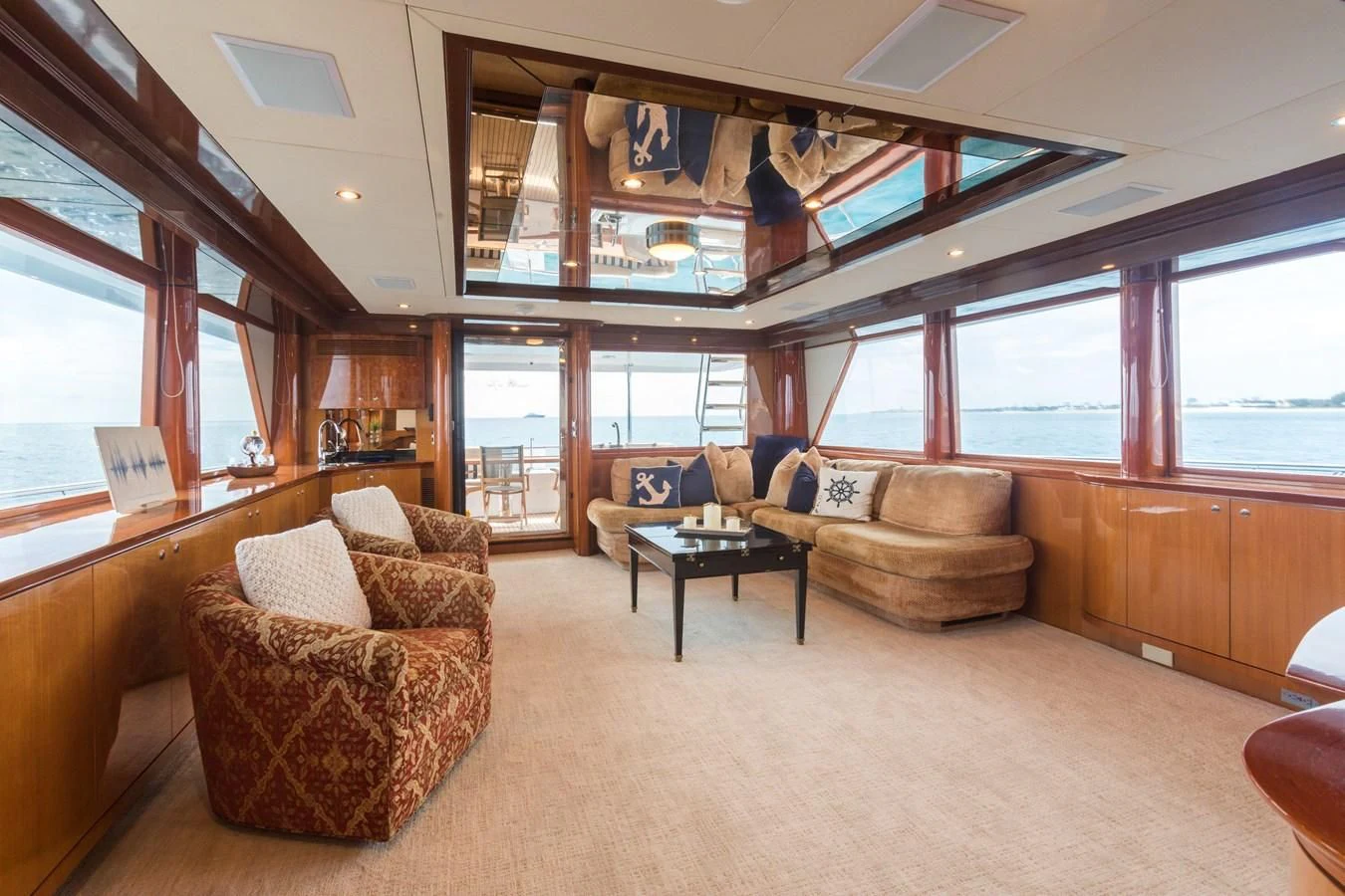 a living room with a large window aboard SOMEWHERE IN TIME Yacht for Sale