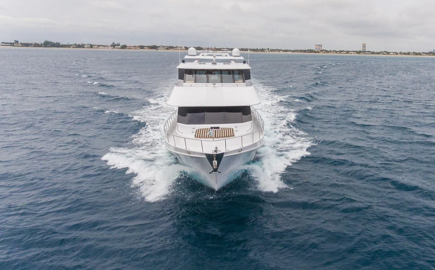 a white boat on the water aboard SOMEWHERE IN TIME Yacht for Sale
