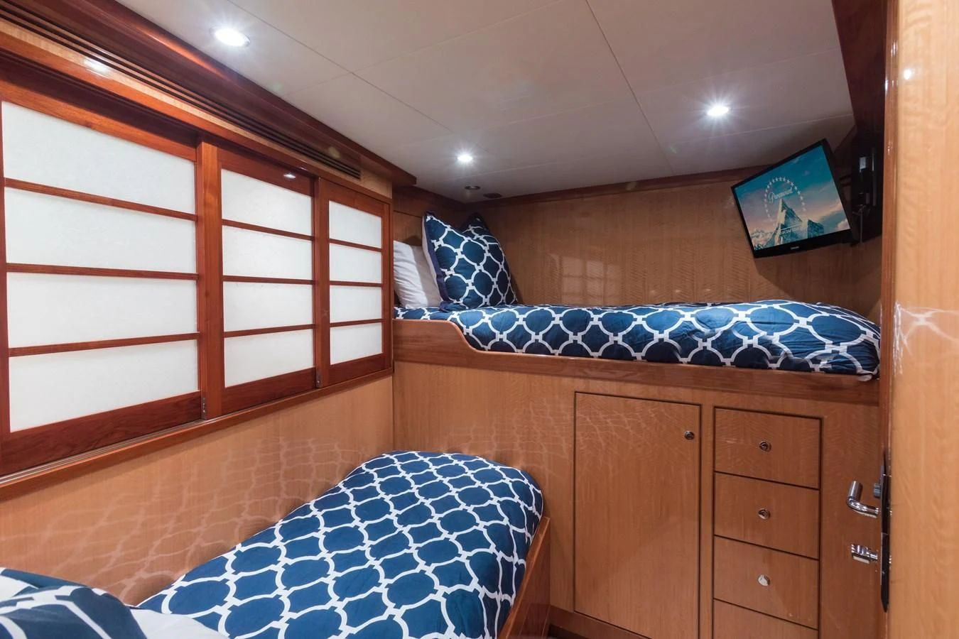 a room with a bed and a dresser aboard SOMEWHERE IN TIME Yacht for Sale
