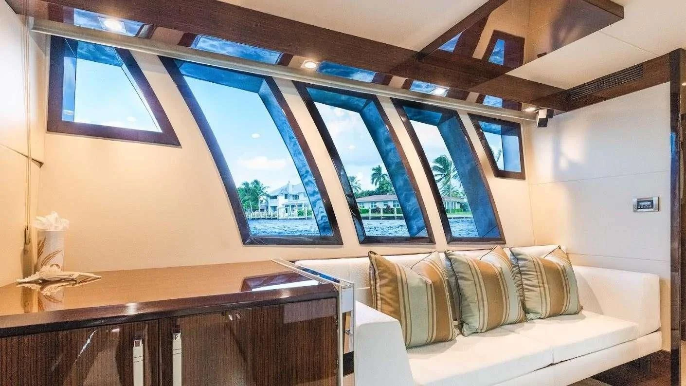 a room with a couch and a table aboard NEW LIFE Yacht for Sale