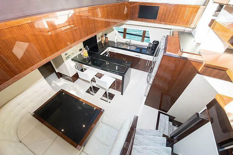 a large room with a large table and chairs aboard NEW LIFE Yacht for Sale