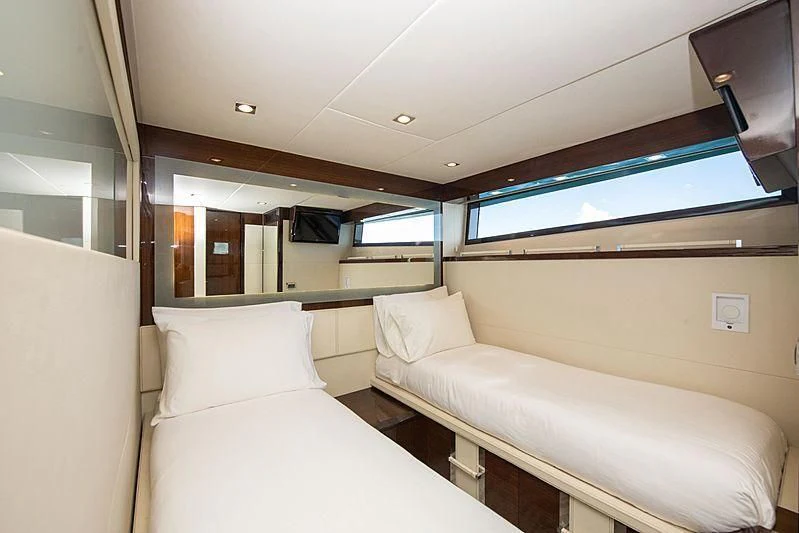 a room with couches and a window aboard NEW LIFE Yacht for Sale