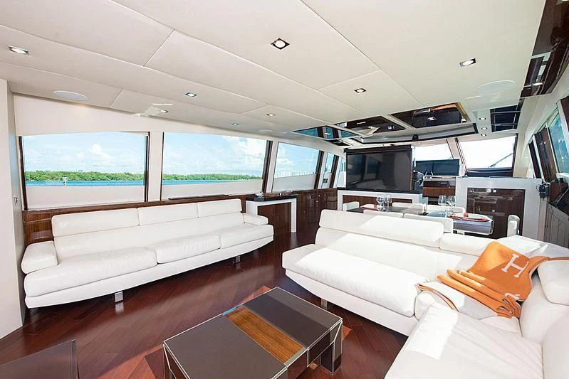 a living room with a couch and a television aboard NEW LIFE Yacht for Sale