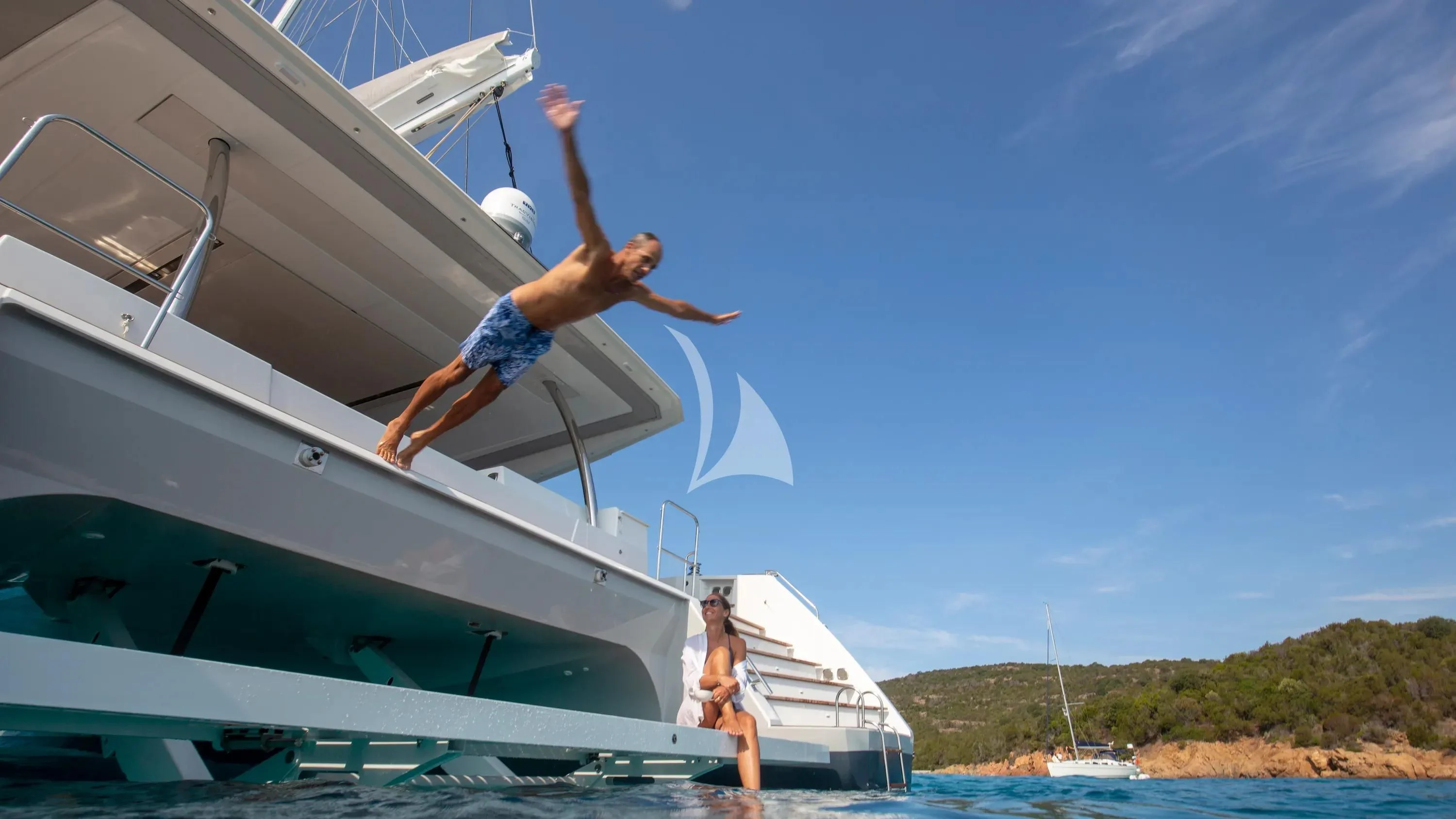 a person jumping off a boat aboard FLORAMYE Yacht for Charter