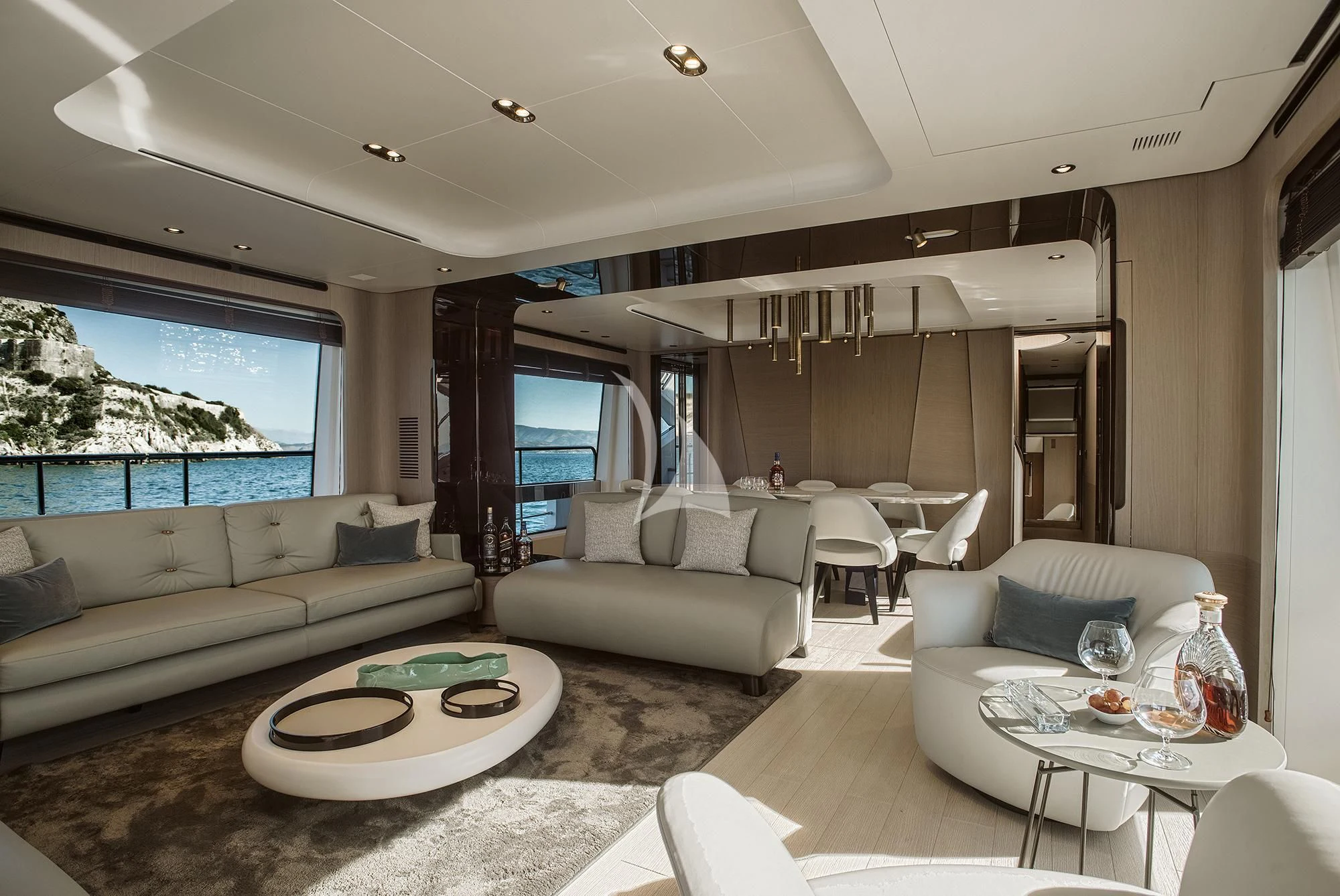 a living room with a large window aboard AGIO Yacht for Charter