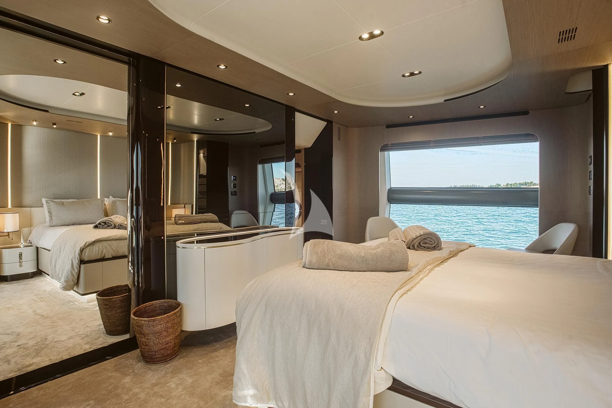 a room with a bed and a large window aboard AGIO Yacht for Charter