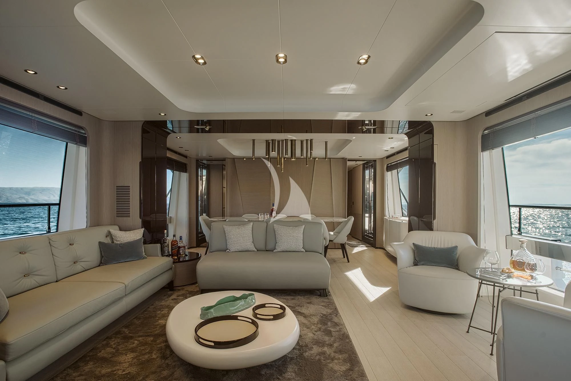 a living room with a couch and a table aboard AGIO Yacht for Charter