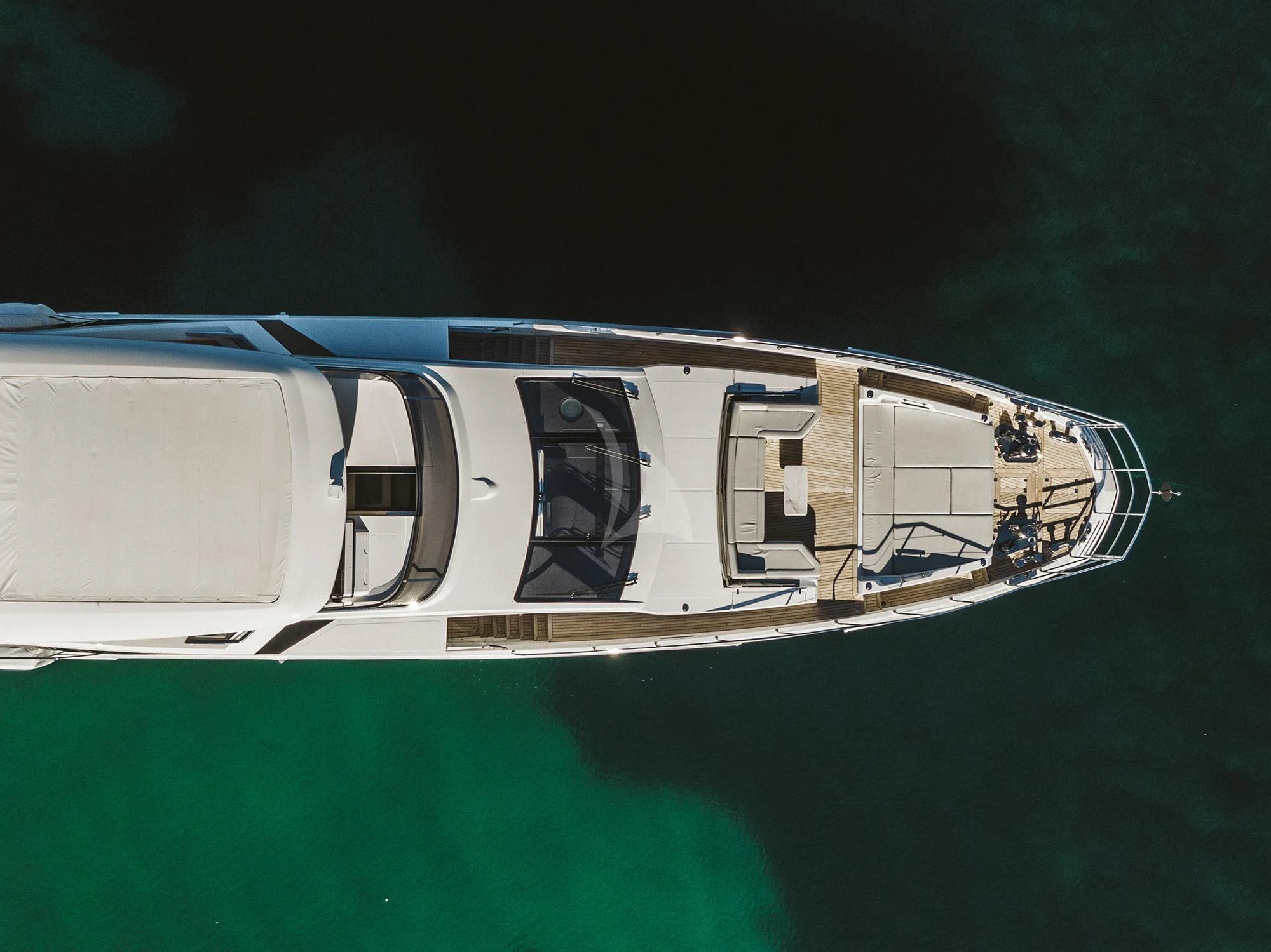 a small white house on a green water body aboard AGIO Yacht for Charter
