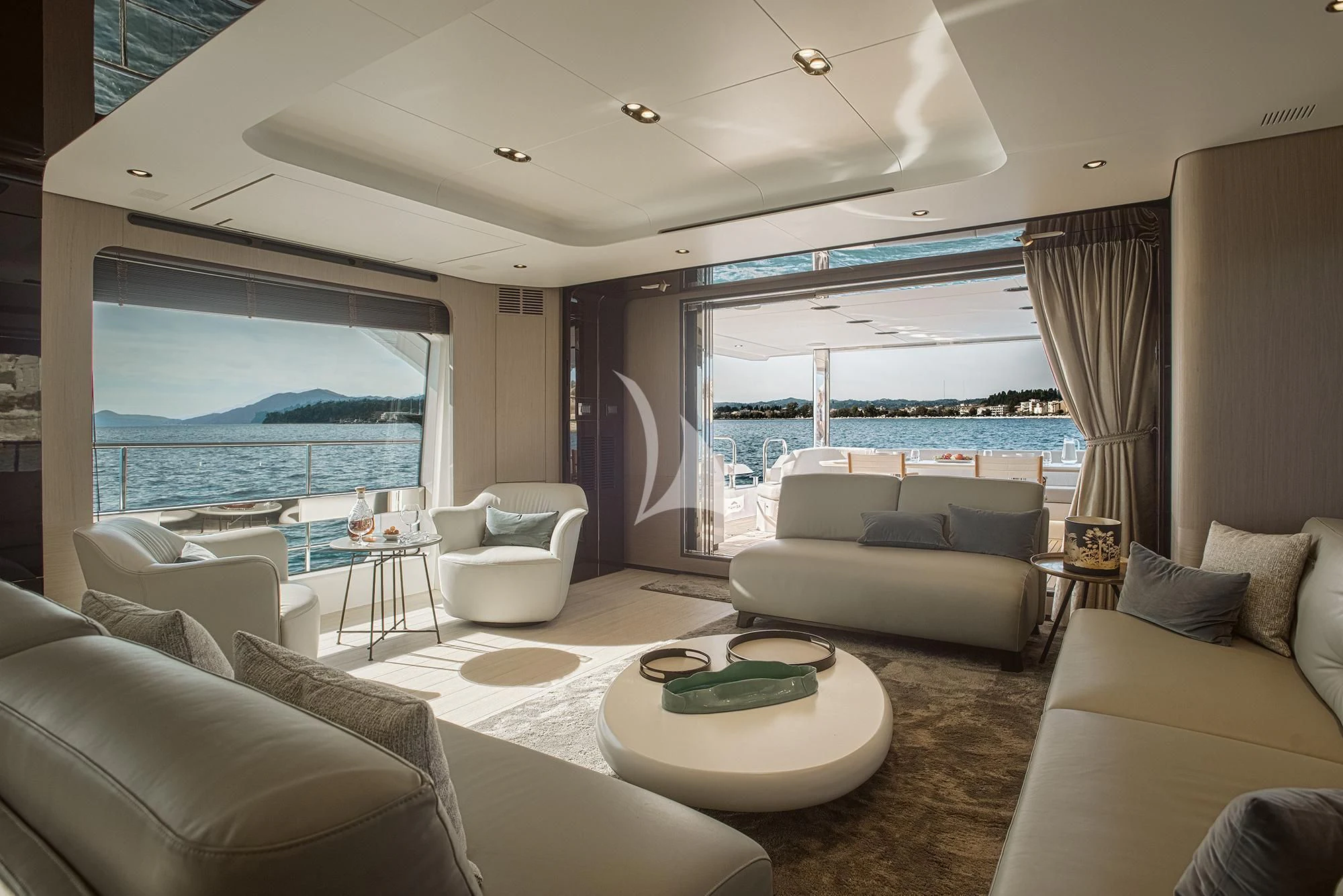 a living room with a large window aboard AGIO Yacht for Charter