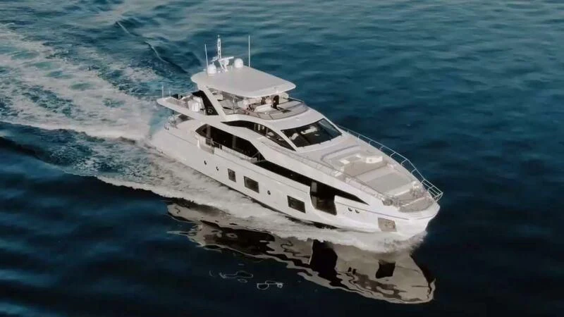 a white boat in the water aboard AGIO Yacht for Charter