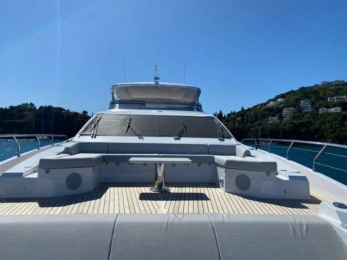 a white yacht on a deck aboard AGIO Yacht for Charter