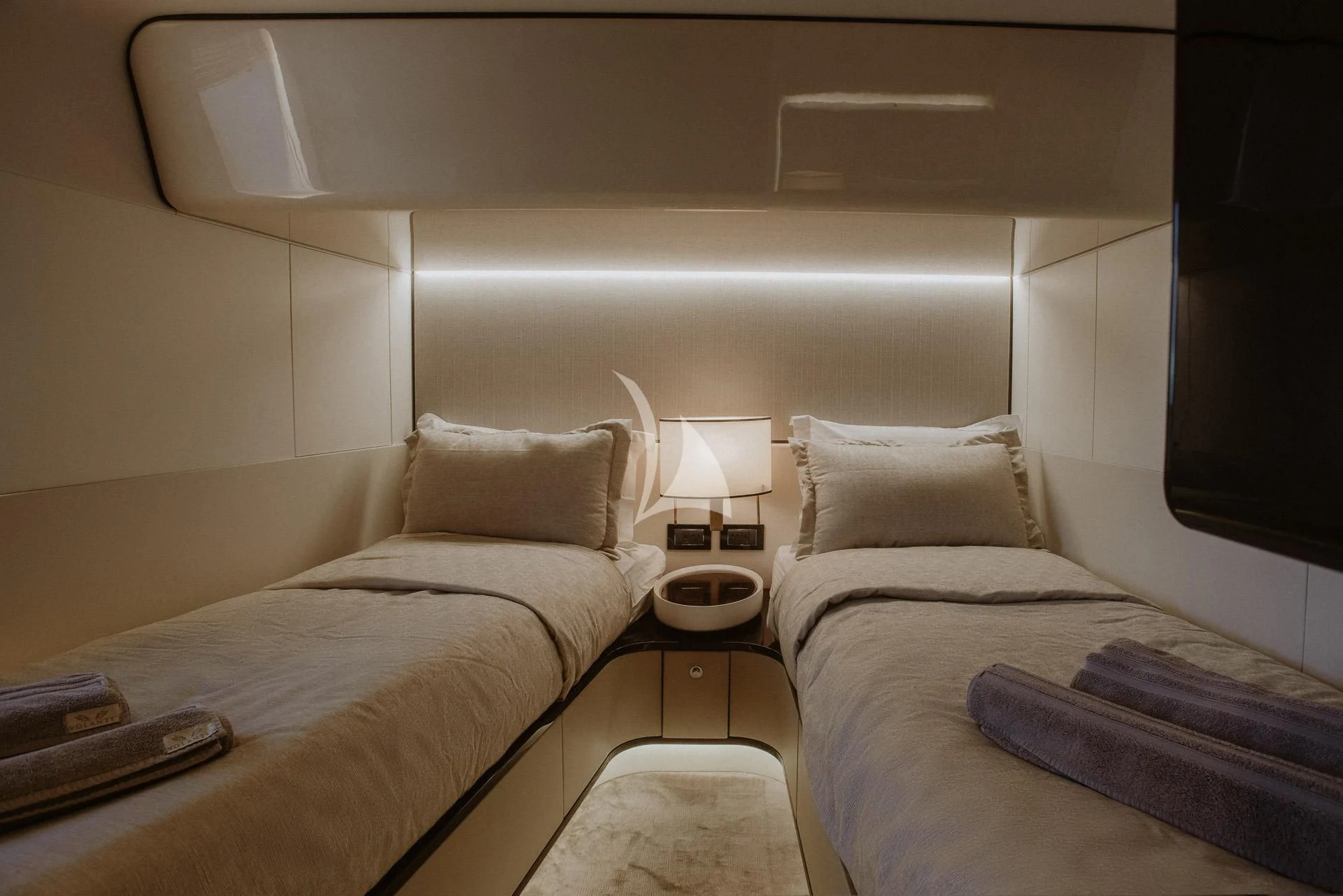 a room with two beds aboard AGIO Yacht for Charter