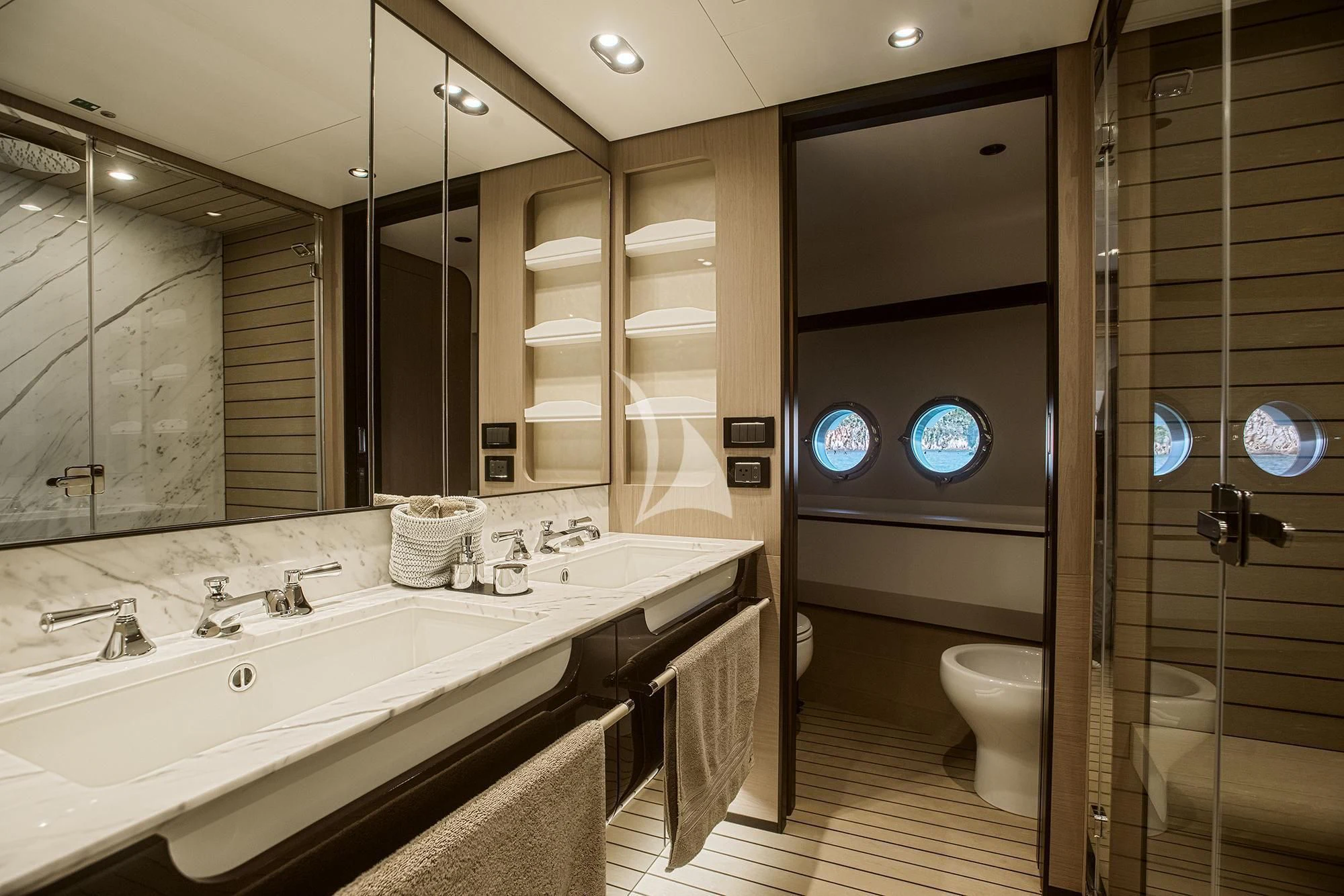 a bathroom with a large mirror aboard AGIO Yacht for Charter
