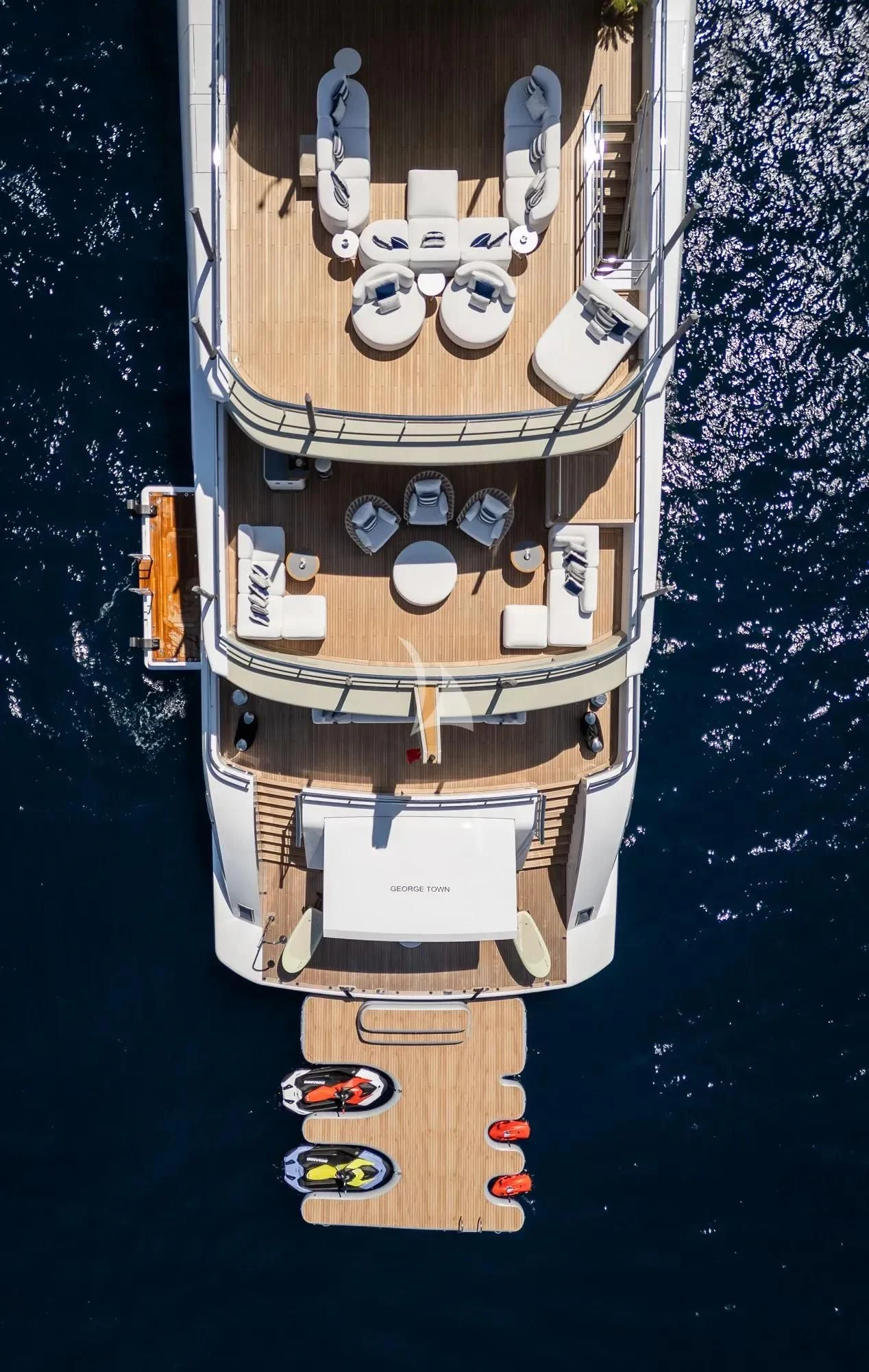 a toy ship on a black surface aboard LADY A Yacht for Sale