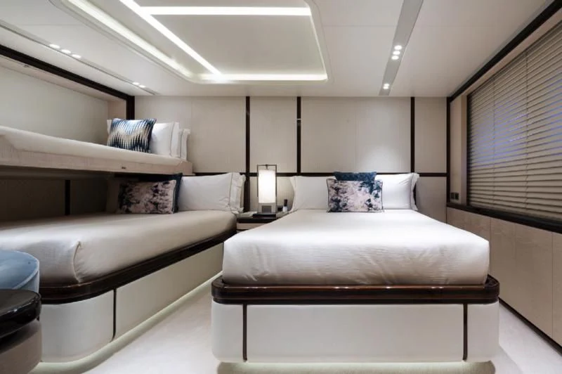 a room with a bed and a couch aboard LADY A Yacht for Sale