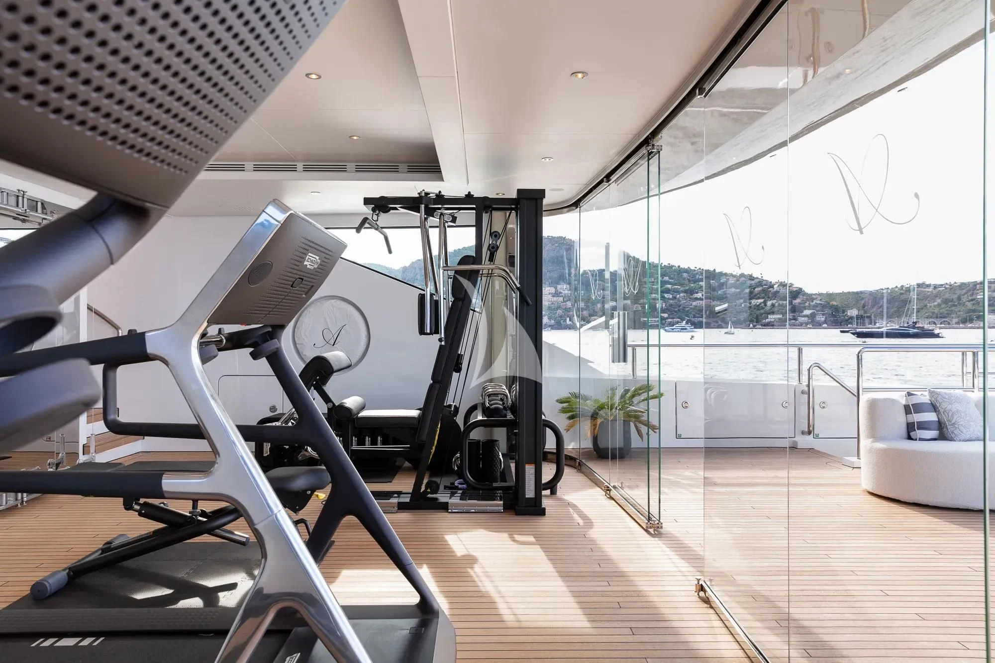 a gym with a large deck aboard LADY A Yacht for Sale