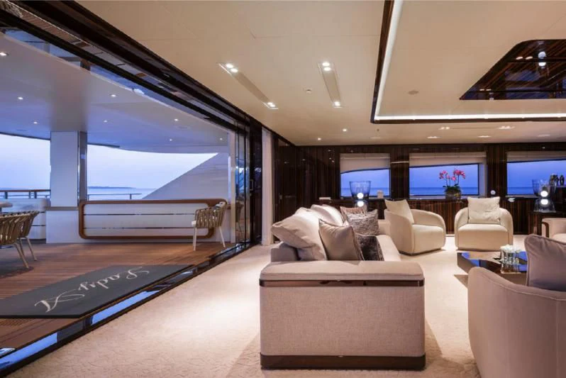 a large living room with a pool table and a large window aboard LADY A Yacht for Sale