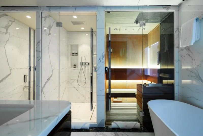 a bathroom with a shower and sink aboard LADY A Yacht for Sale